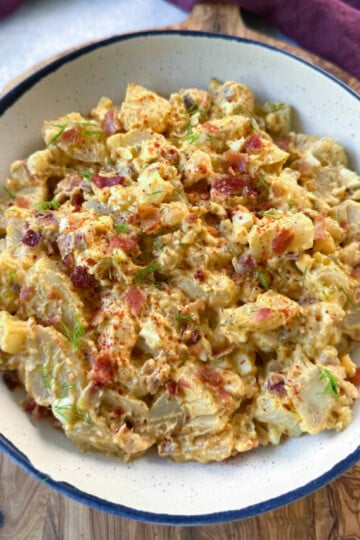 bacon ranch potato salad in a white bowl