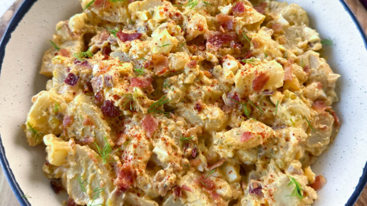 bacon ranch potato salad in a white bowl