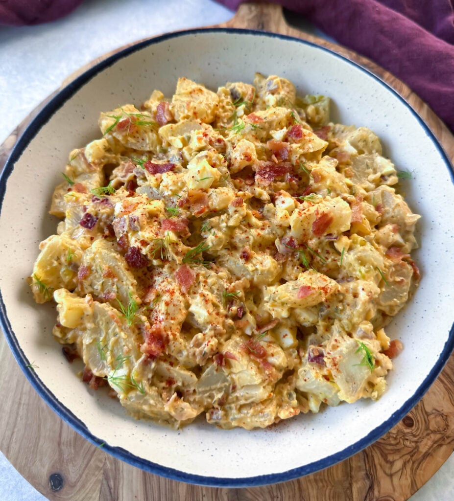 bacon ranch potato salad in a white bowl