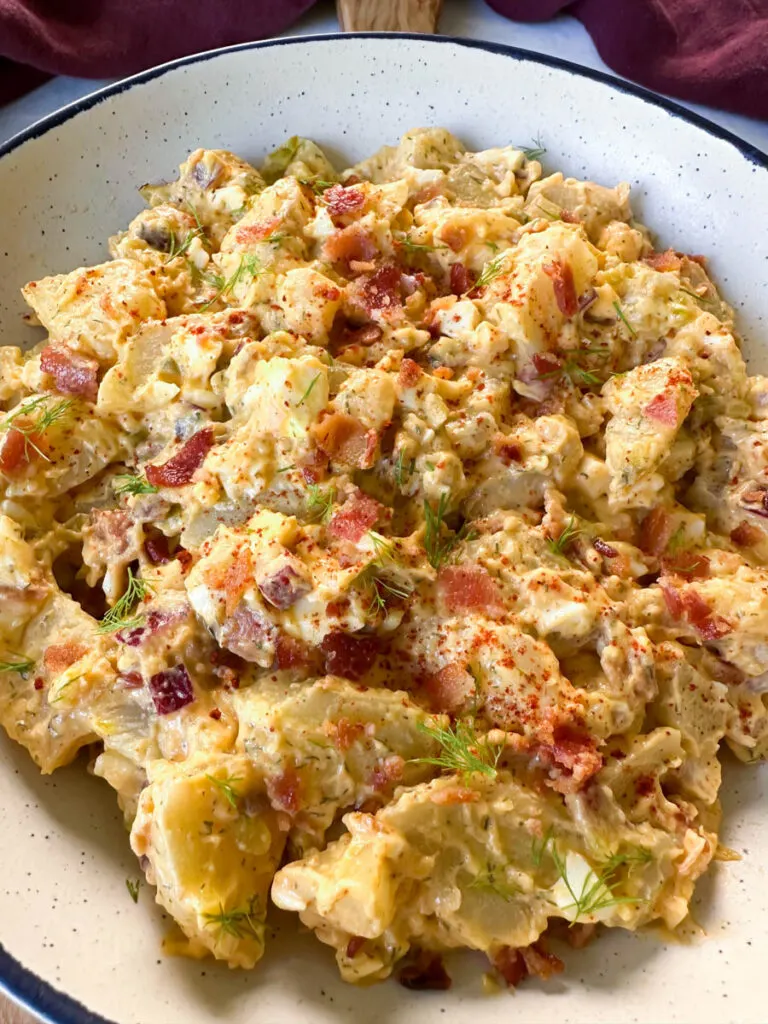 bacon ranch potato salad in a white bowl