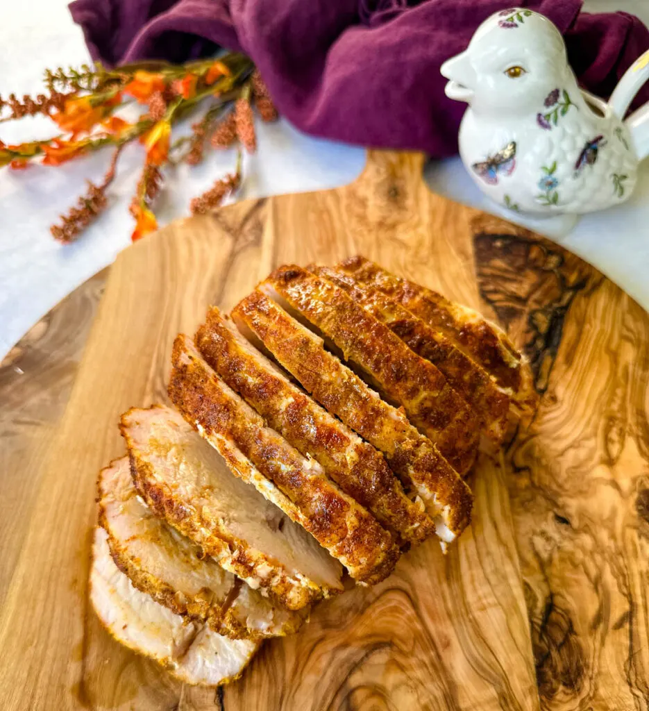 sliced boneless turkey breast on a cutting board