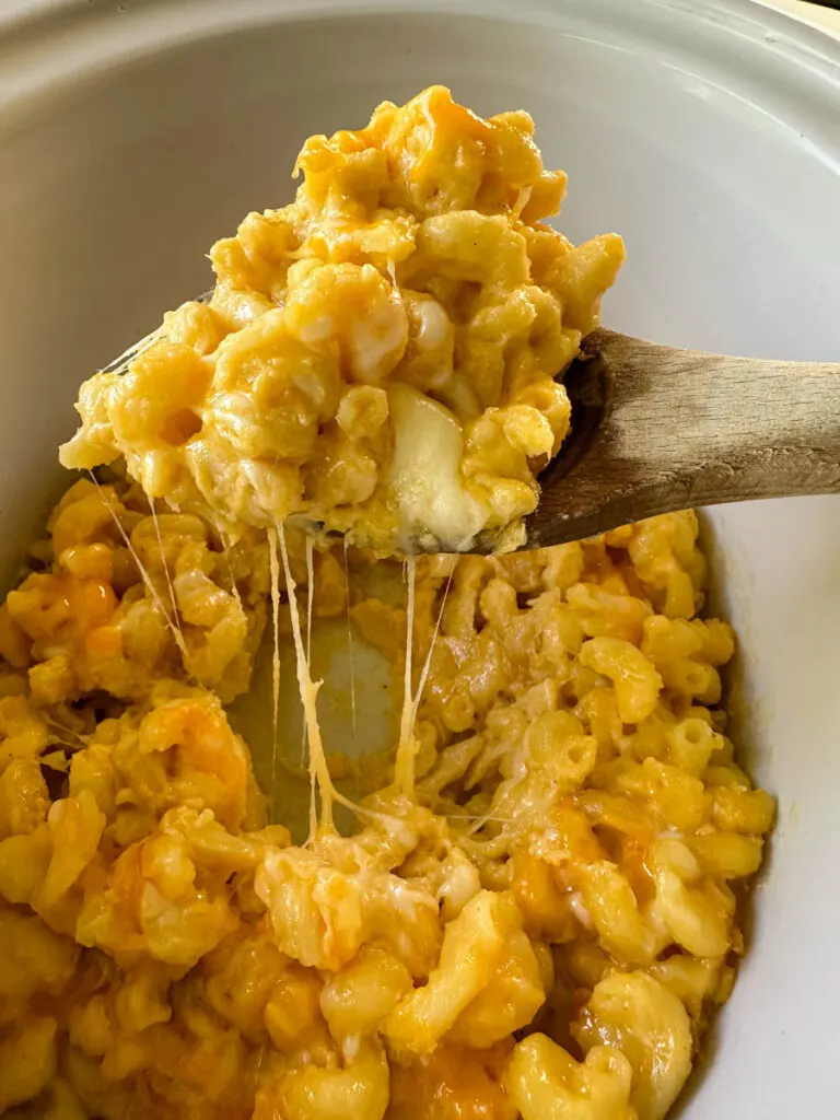 a wooden spoonful of slow cooker Crockpot mac and cheese