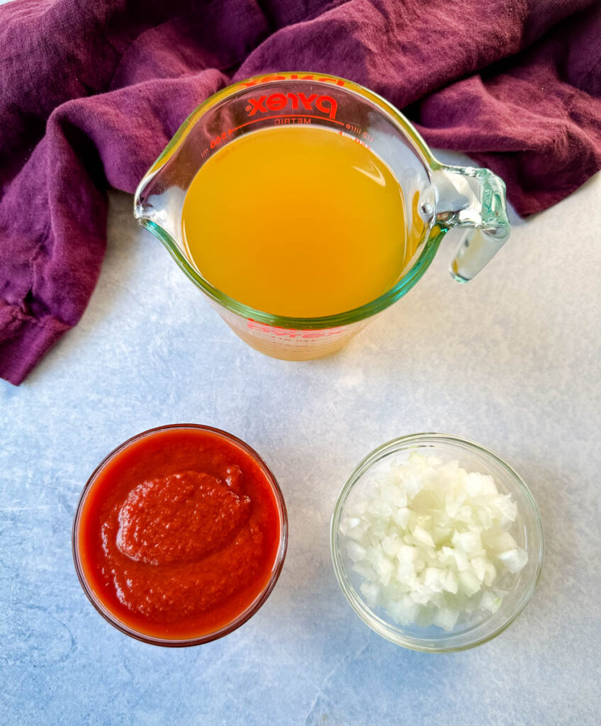 broth, tomato sauce, and diced onions in separate glass bowls