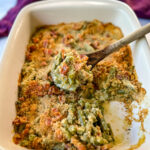 green bean casserole with bacon and breadcrumbs in a baking dish