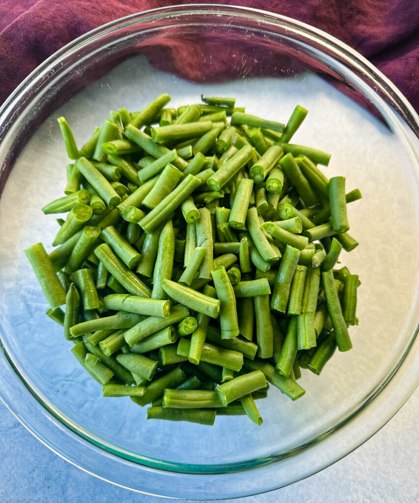 fresh, cut green beans in a glass bowl
