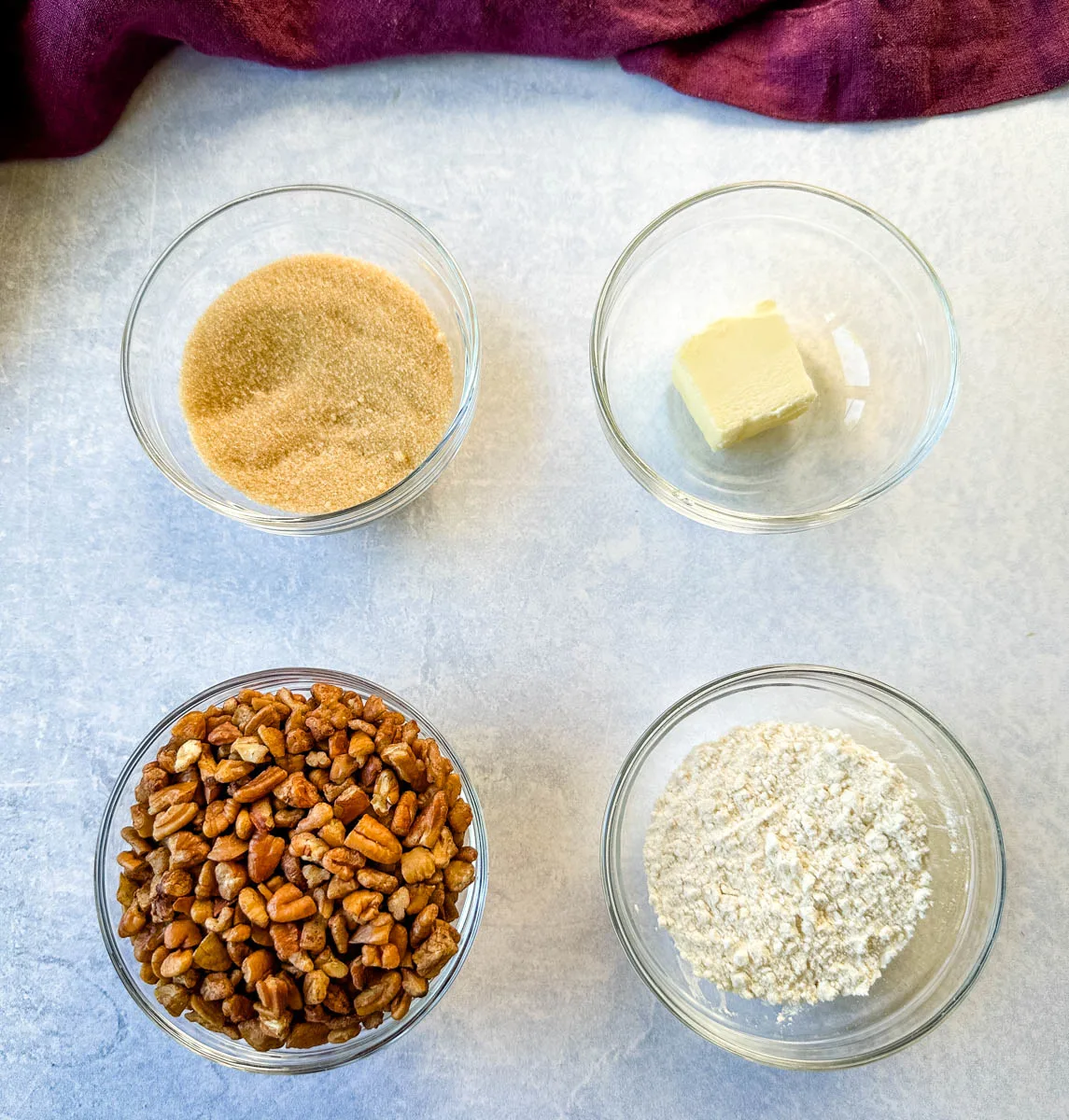 brown sugar or sweetener, pecans, butter, and flour in separate glass bowls