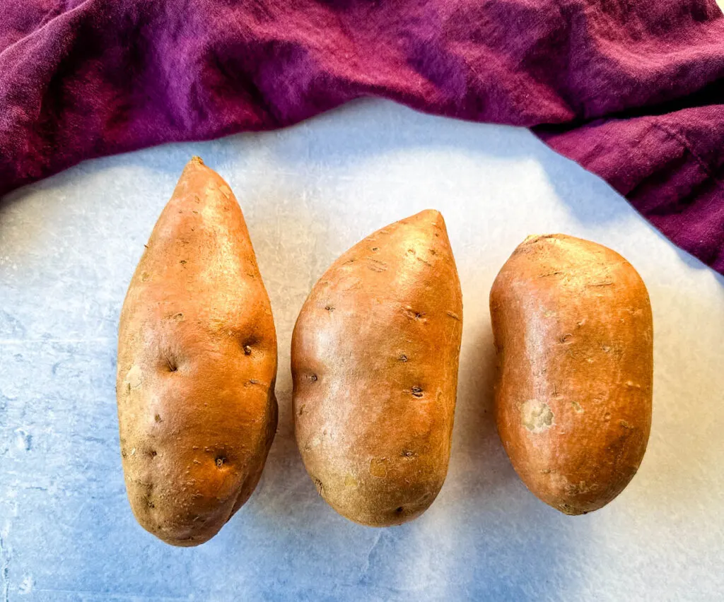 raw sweet potatoes on a flat surface