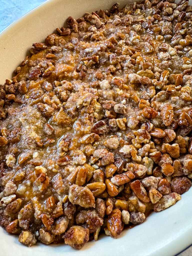 sweet potato casserole with pecans in a baking dish