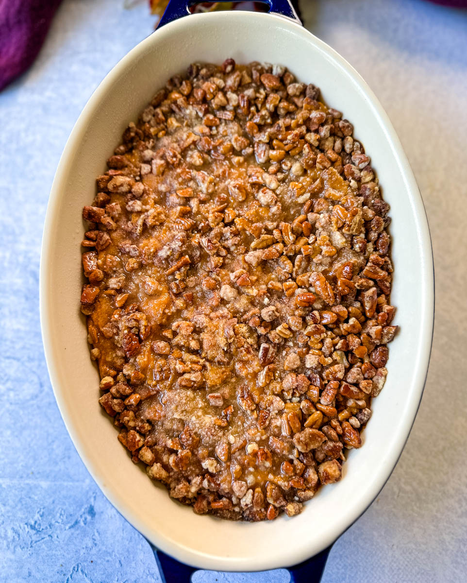 sweet potato casserole with pecans in a baking dish