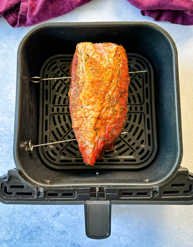 raw seasoned roast beef in an air fryer