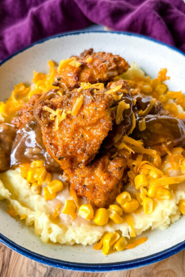 KFC famous mashed potatoes bowl with chicken, gravy, and cheese