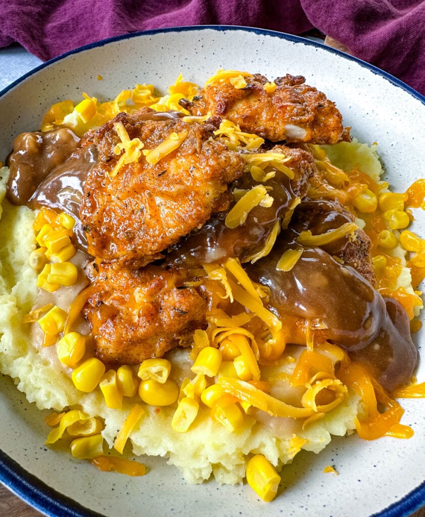 KFC famous mashed potatoes bowl with chicken, gravy, and cheese