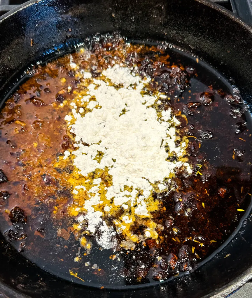 prime rib drippings, herbs, butter, and flour in a cast iron skillet