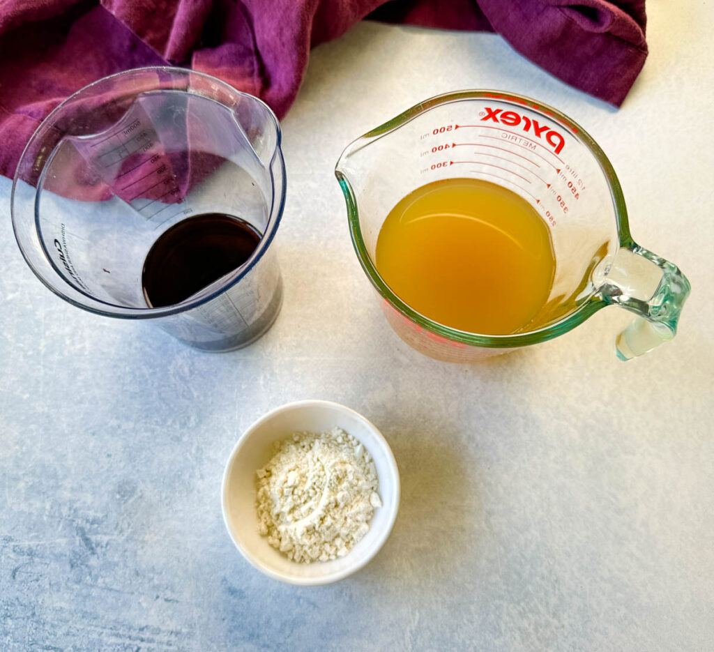 beef broth, red wine, and flour in separate glass bowls