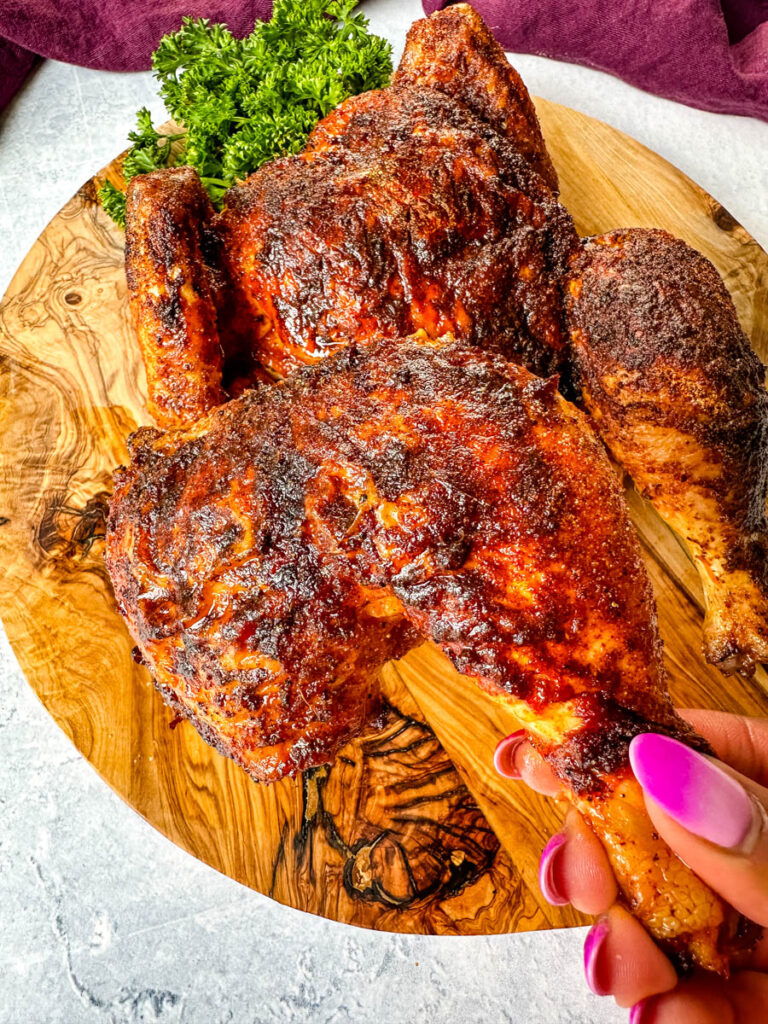 person holding Thanksgiving chicken leg