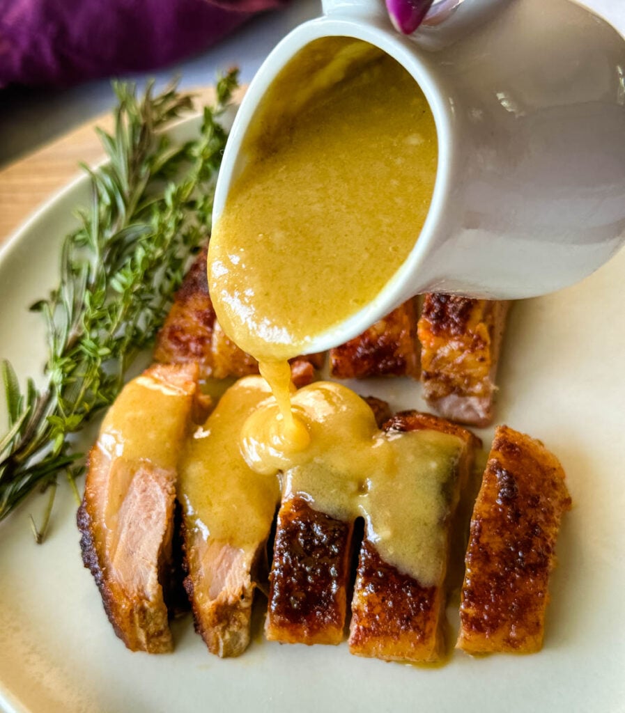 slow cooker Crockpot duck breast sliced and drizzled with duck fat gravy