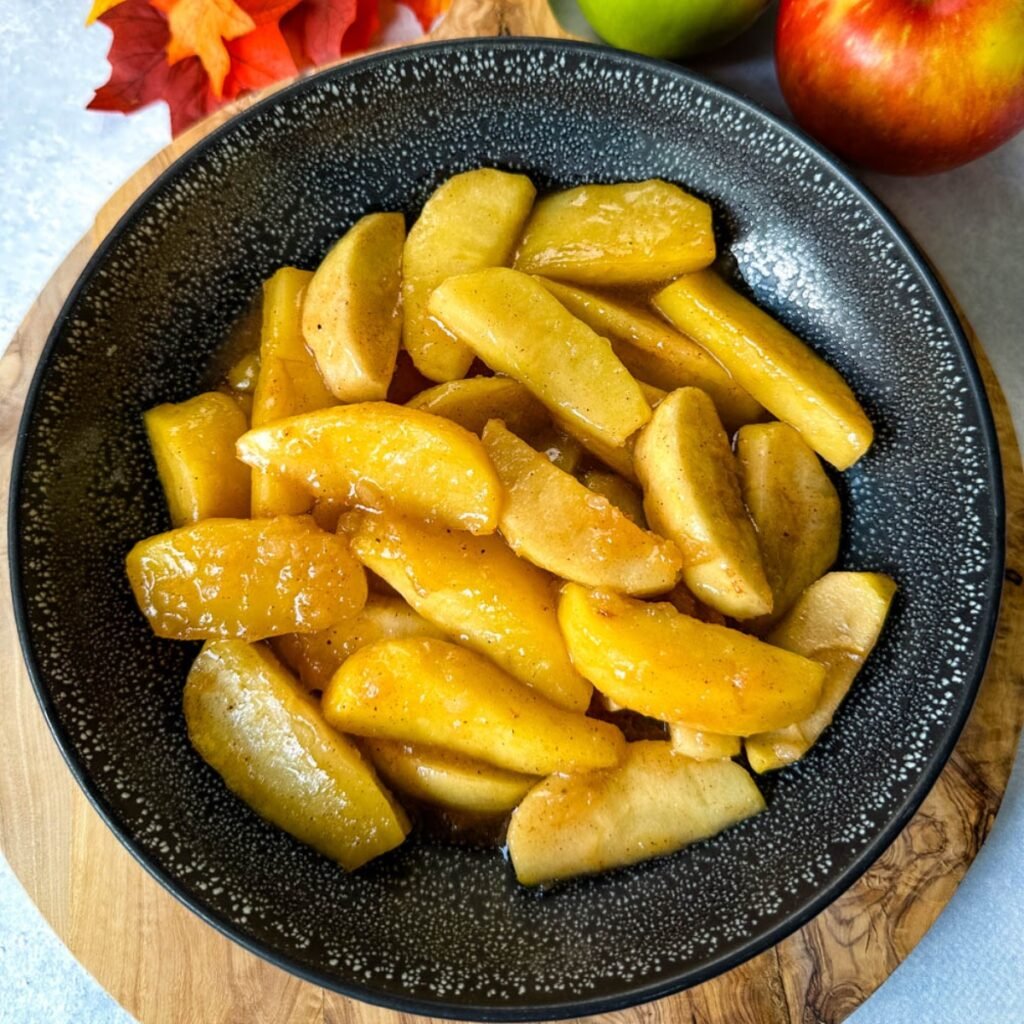 Southern fried apples with cinnamon in a black bowl