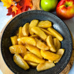 Southern fried apples with cinnamon in a black bowl