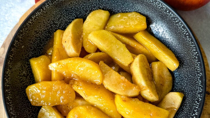 Southern fried apples with cinnamon in a black bowl