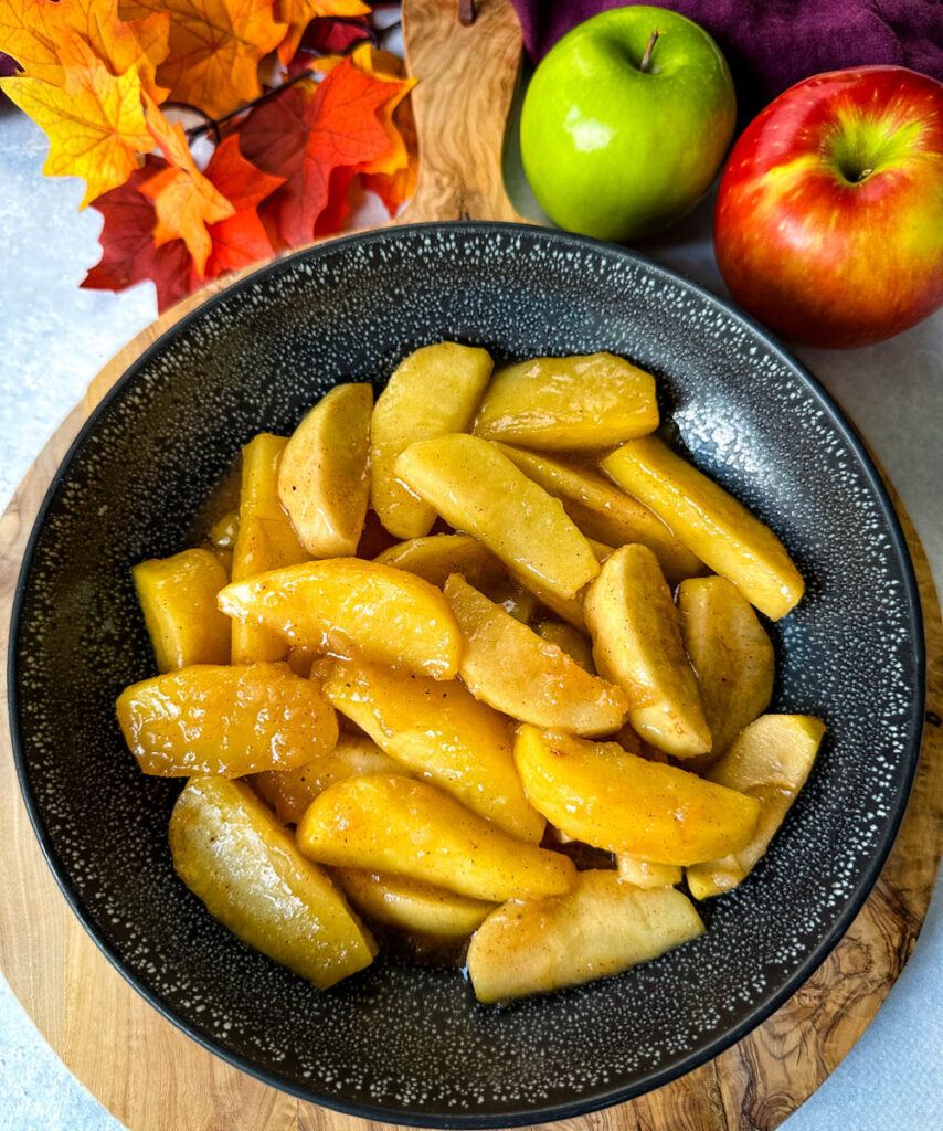 Southern fried apples with cinnamon in a black bowl