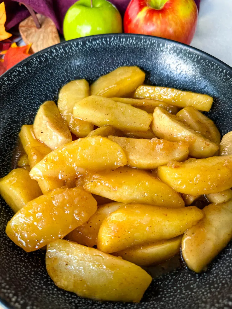 Southern fried apples with cinnamon in a black bowl