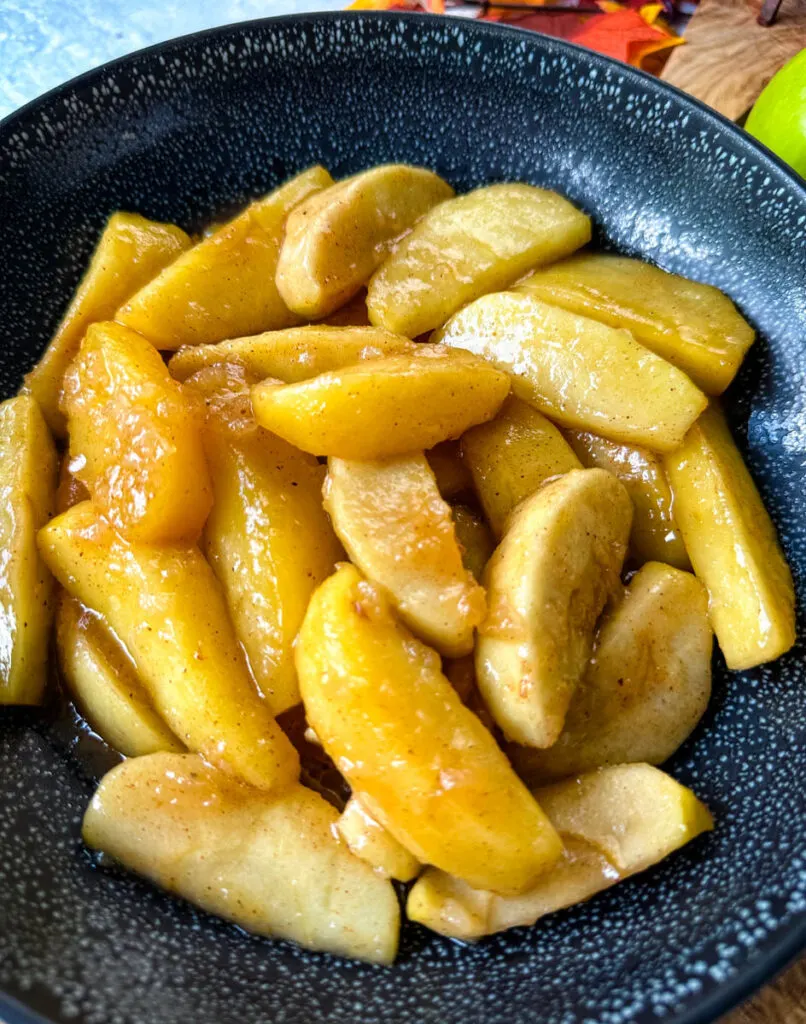 Southern fried apples with cinnamon in a black bowl