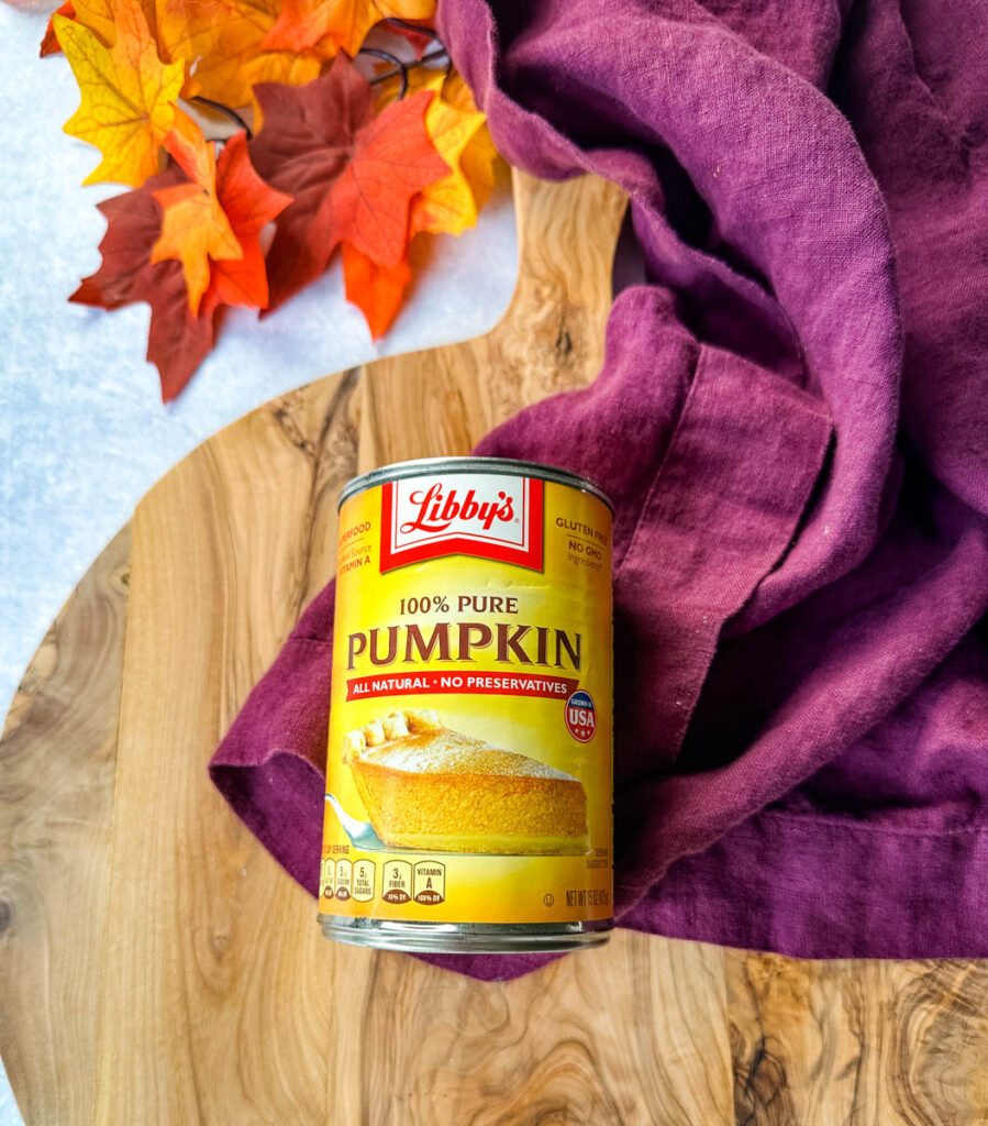 canned pure pumpkin on a flat surface