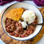 Southern Cajun red beans and rice with smoked turkey in a bowl with cornbread