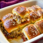 Kings Hawaiian Sliders with cheese in a red baking dish