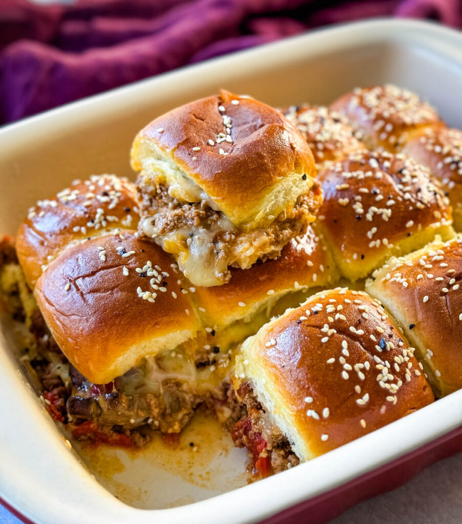 Kings Hawaiian Sliders with cheese in a red baking dish