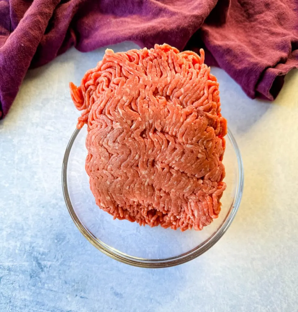 raw ground beef in a glass bowl