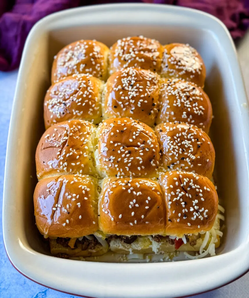 Kings Hawaiian Sliders with cheese in a red baking dish