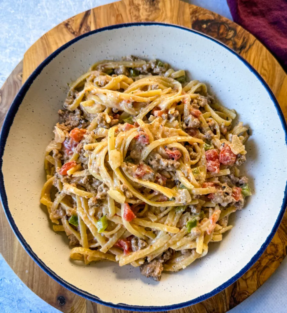 beef alfredo pasta in a white bowl