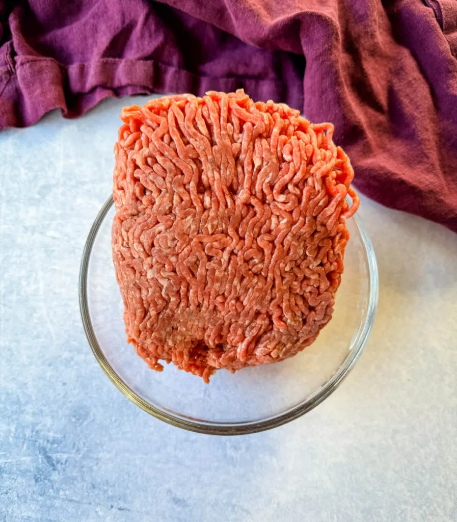 raw ground beef in a glass bowl