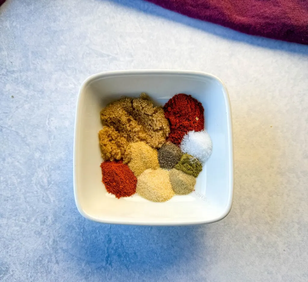 homemade Cajun rub seasonings in a white bowl