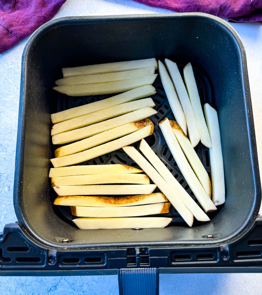 sliced potatoes in an air fryer