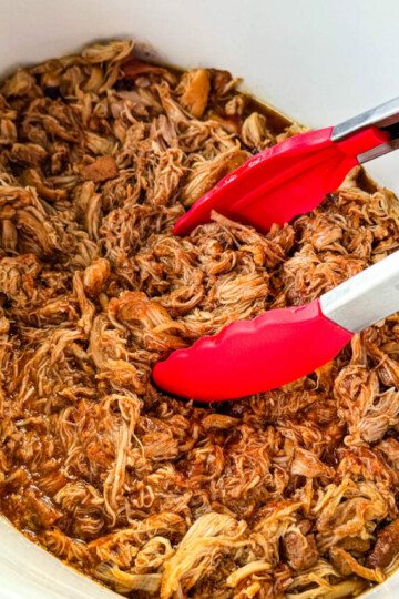 pulled chicken and BBQ sauce in a white Crockpot slow cooker