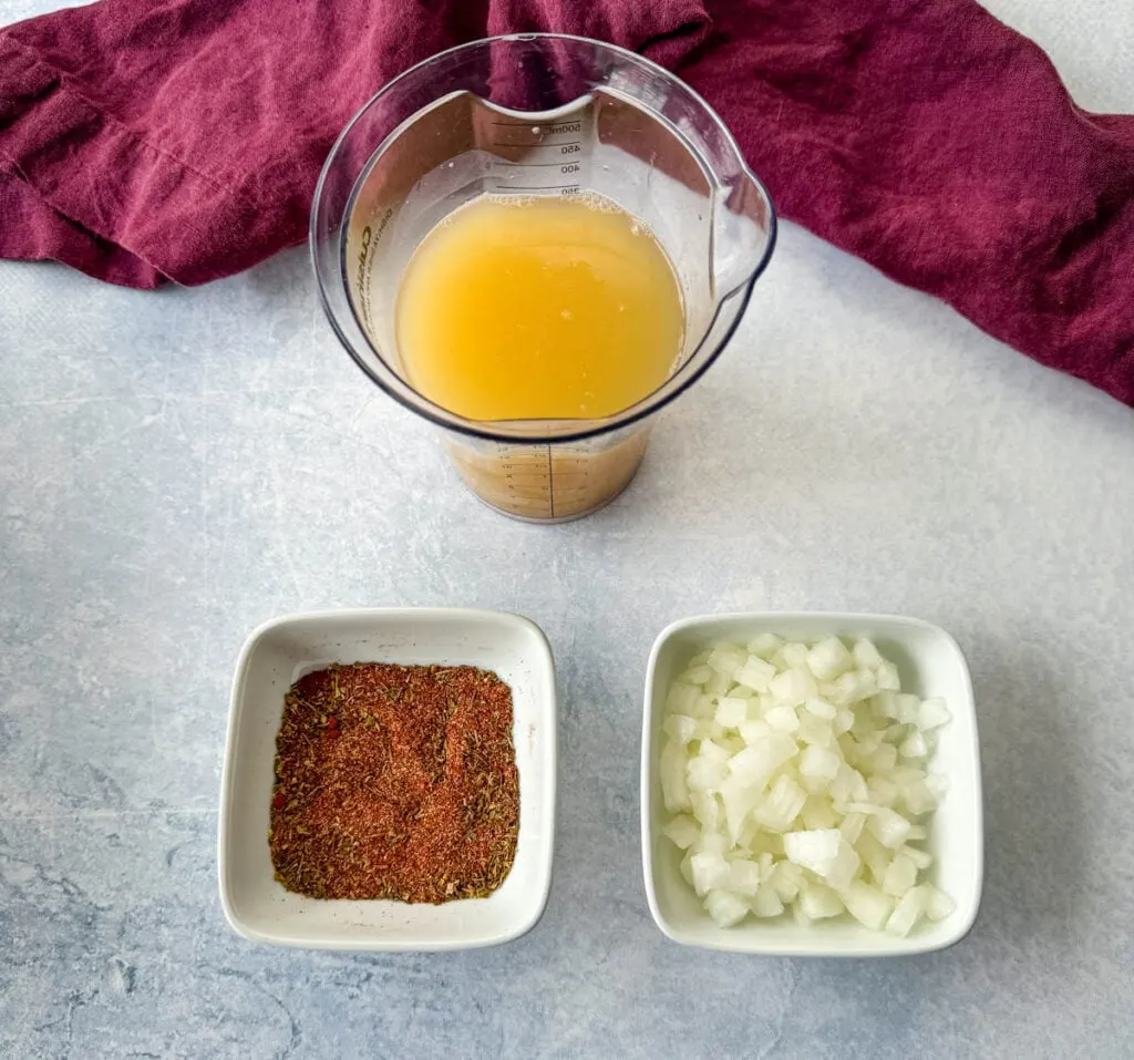 broth, spices, and diced onions in separate white bowls