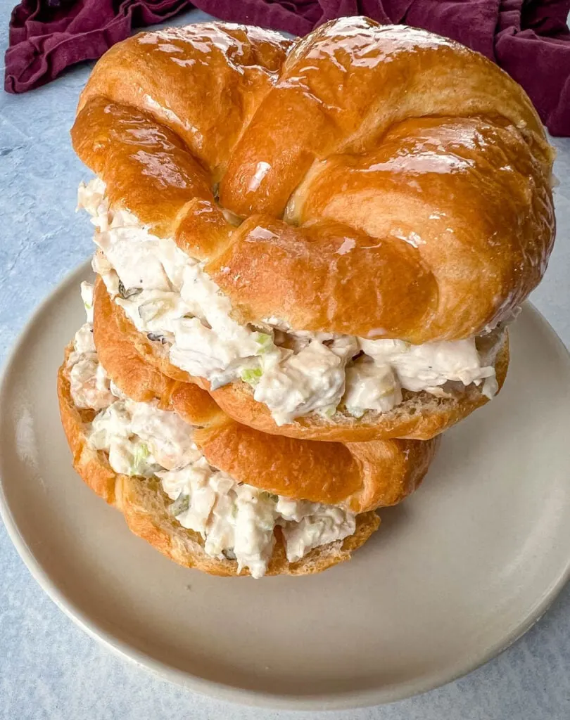 classic chicken salad on a croissant sandwich on a plate