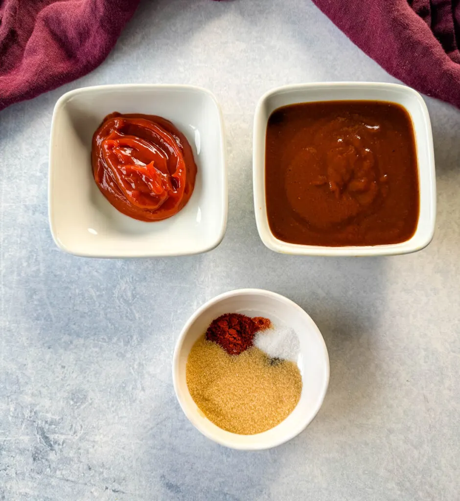 ketchup, BBQ sauce, and BBQ rub in separate white bowls