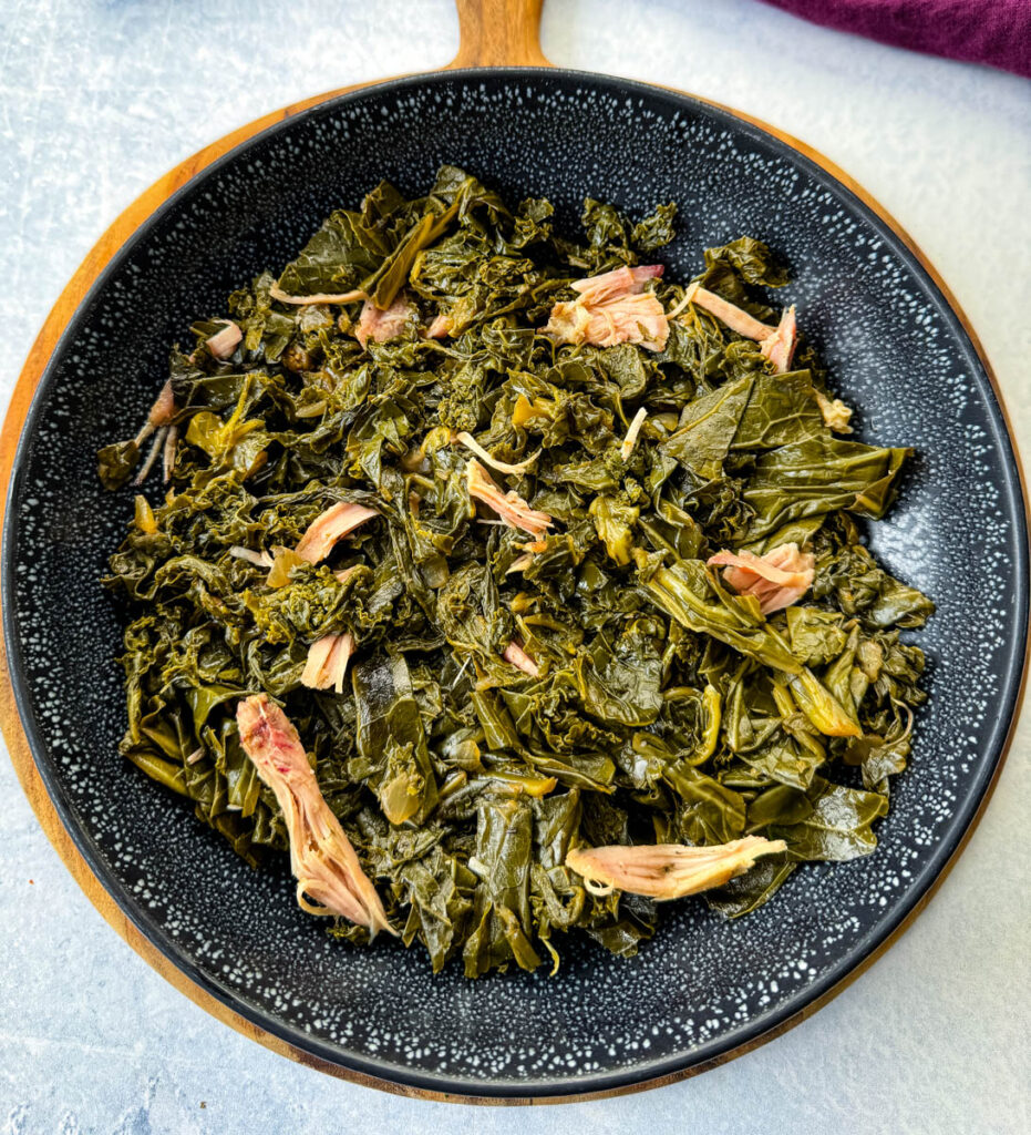 mixed greens, collard greens, turnip greens, mustard greens, and kale in a black bowl