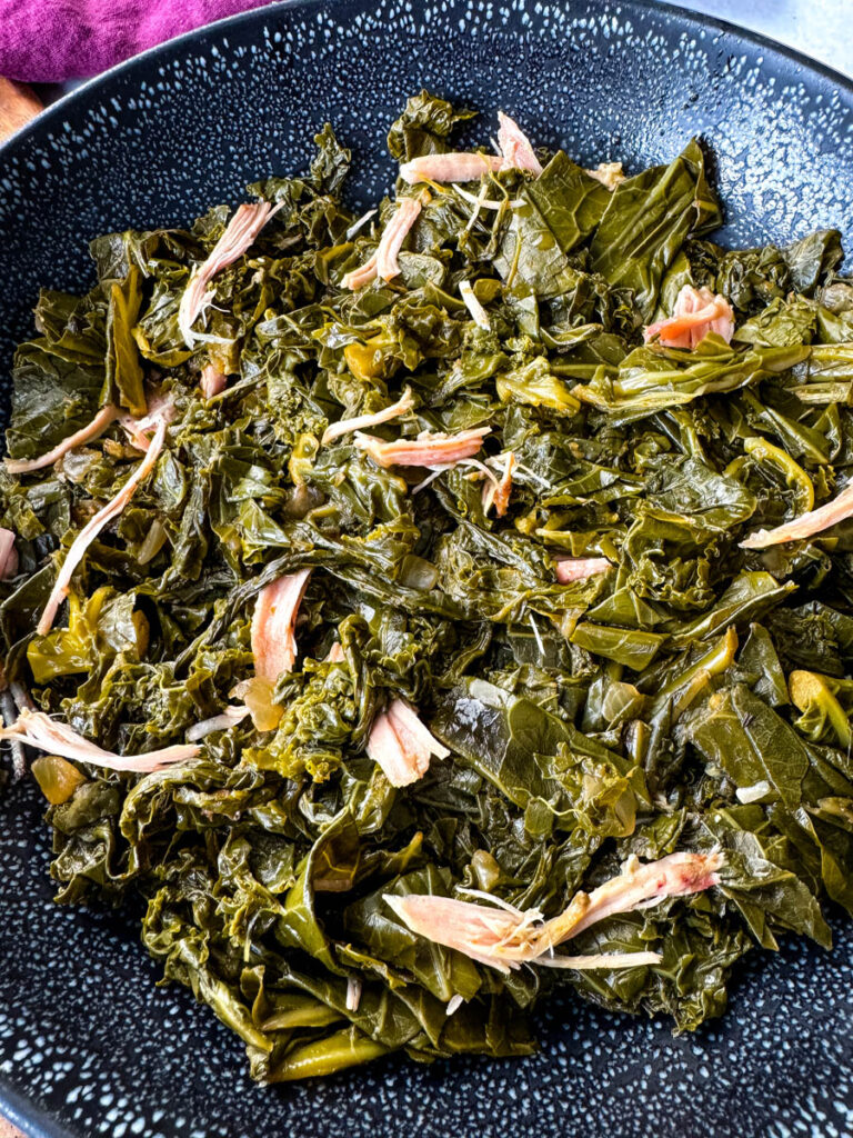 mixed greens, collard greens, turnip greens, mustard greens, and kale in a Dutch oven with smoked turkey