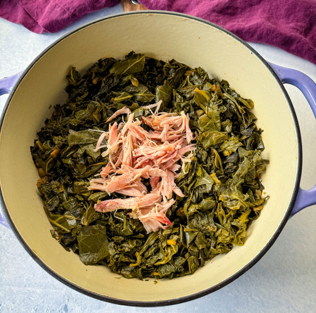 mixed greens, collard greens, turnip greens, mustard greens, and kale in a Dutch oven with smoked turkey