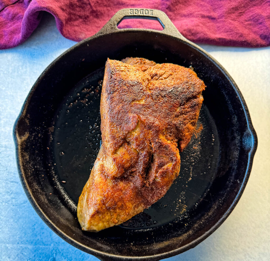 seared brisket in a cast iron skillet