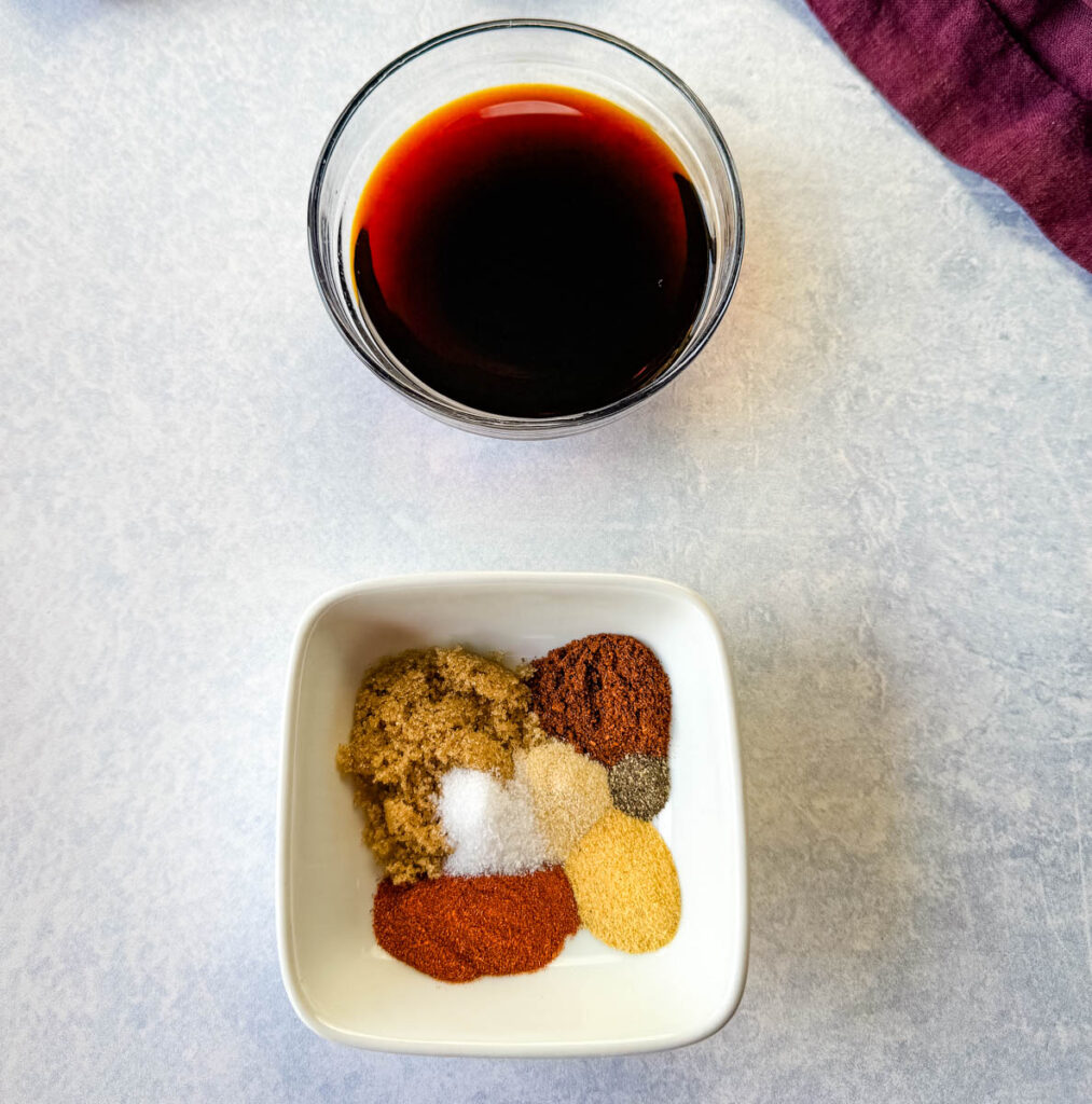 soy sauce, and homemade BBQ chicken rub spices in separate white and glass bowls