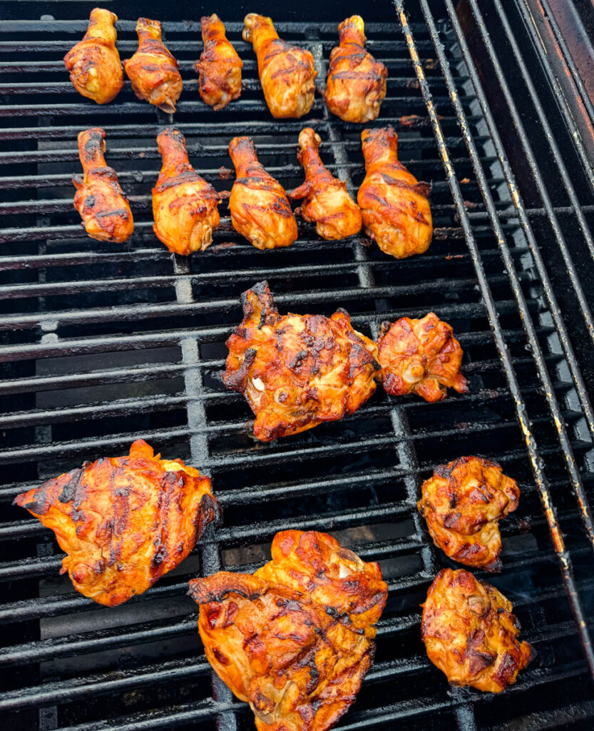 chicken thighs and drumsticks on a grill