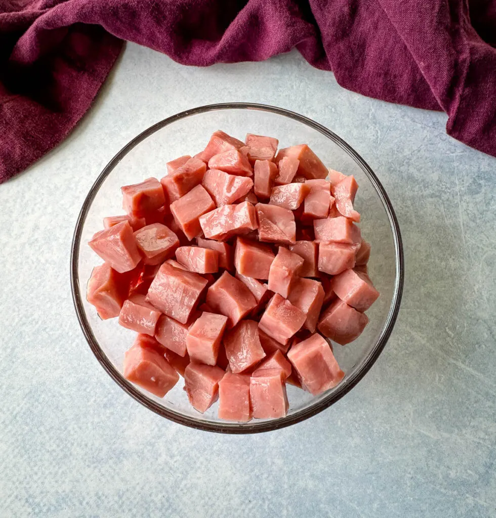 diced cubes of ham in a glass bowl