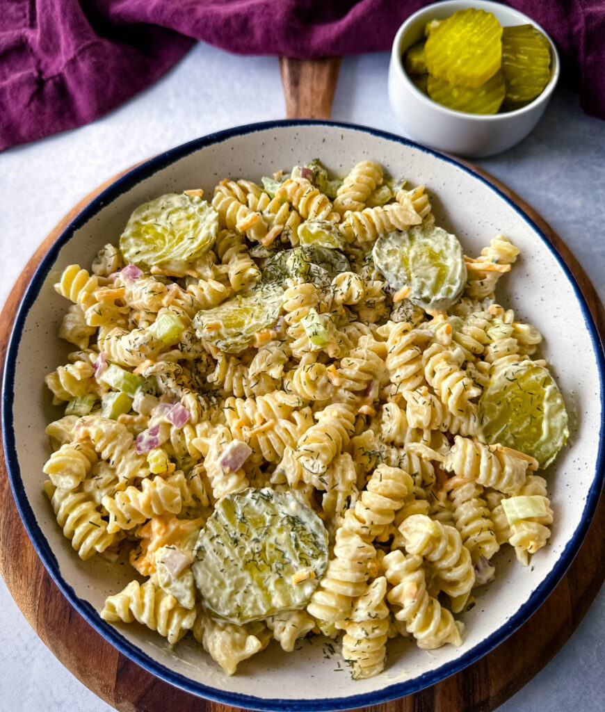 dill pickle pasta salad in a white bowl