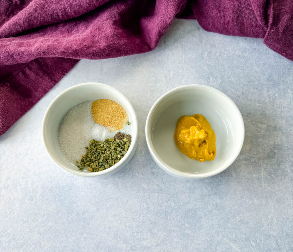 spices and mustard in separate white bowls