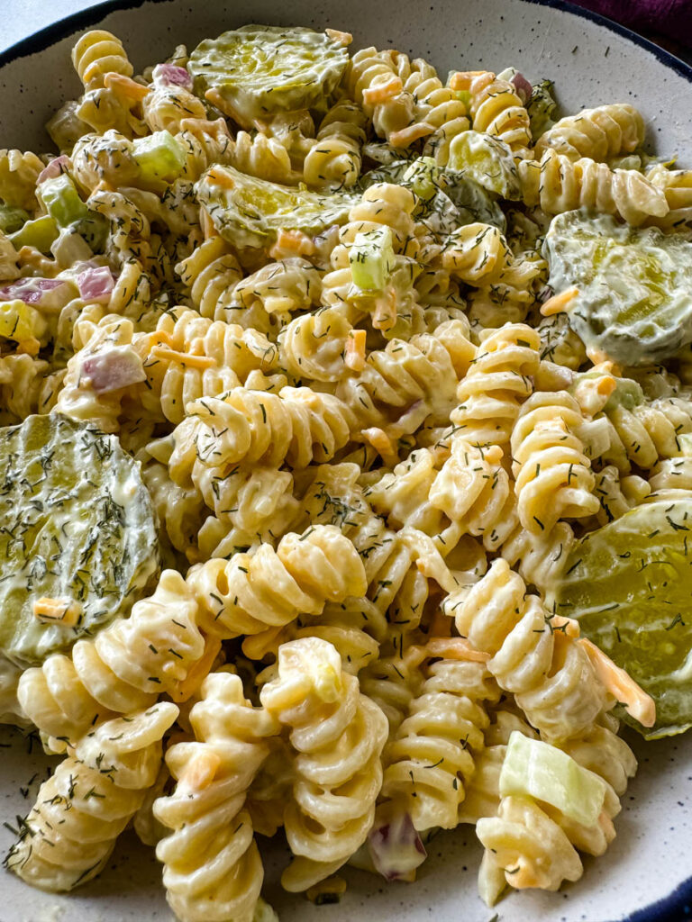 dill pickle pasta salad in a white bowl